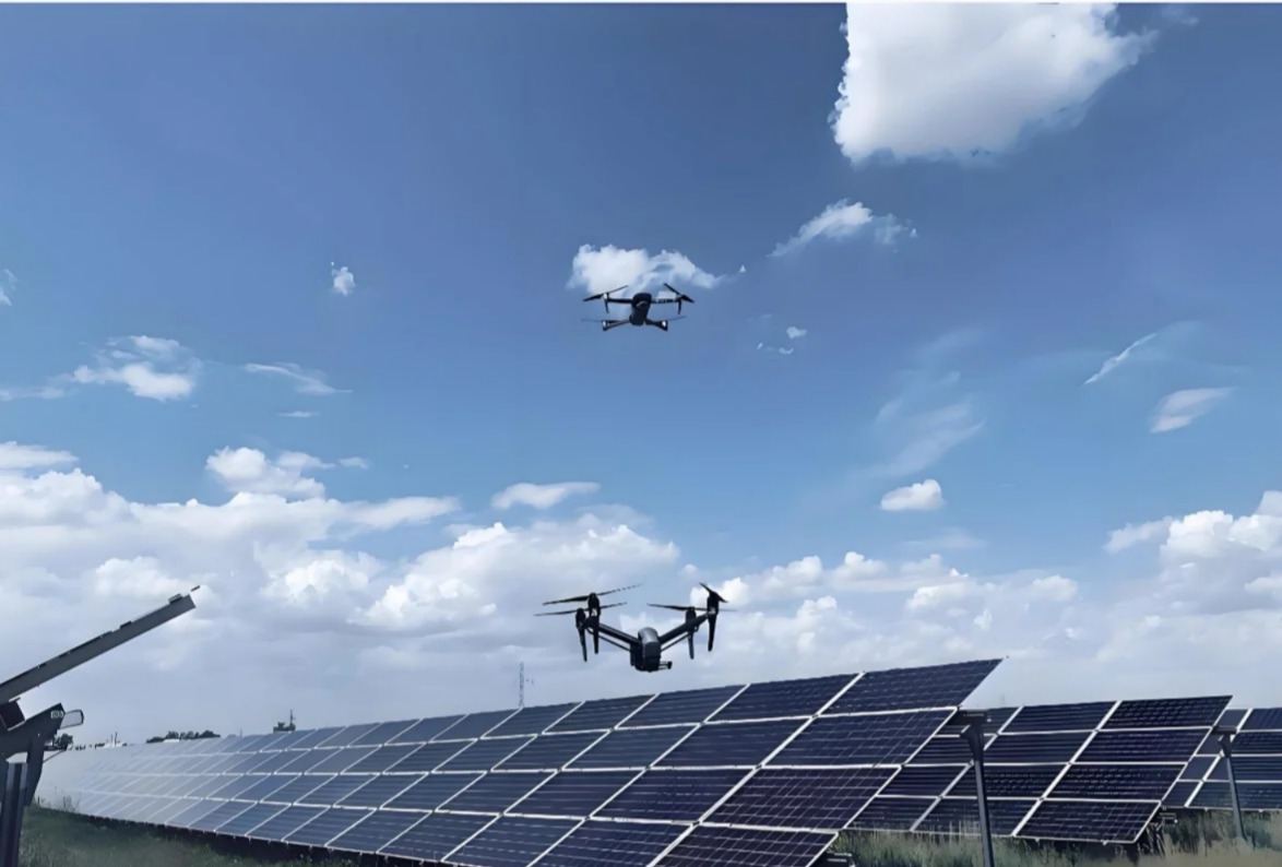 Drones flying over a photovoltaic plant